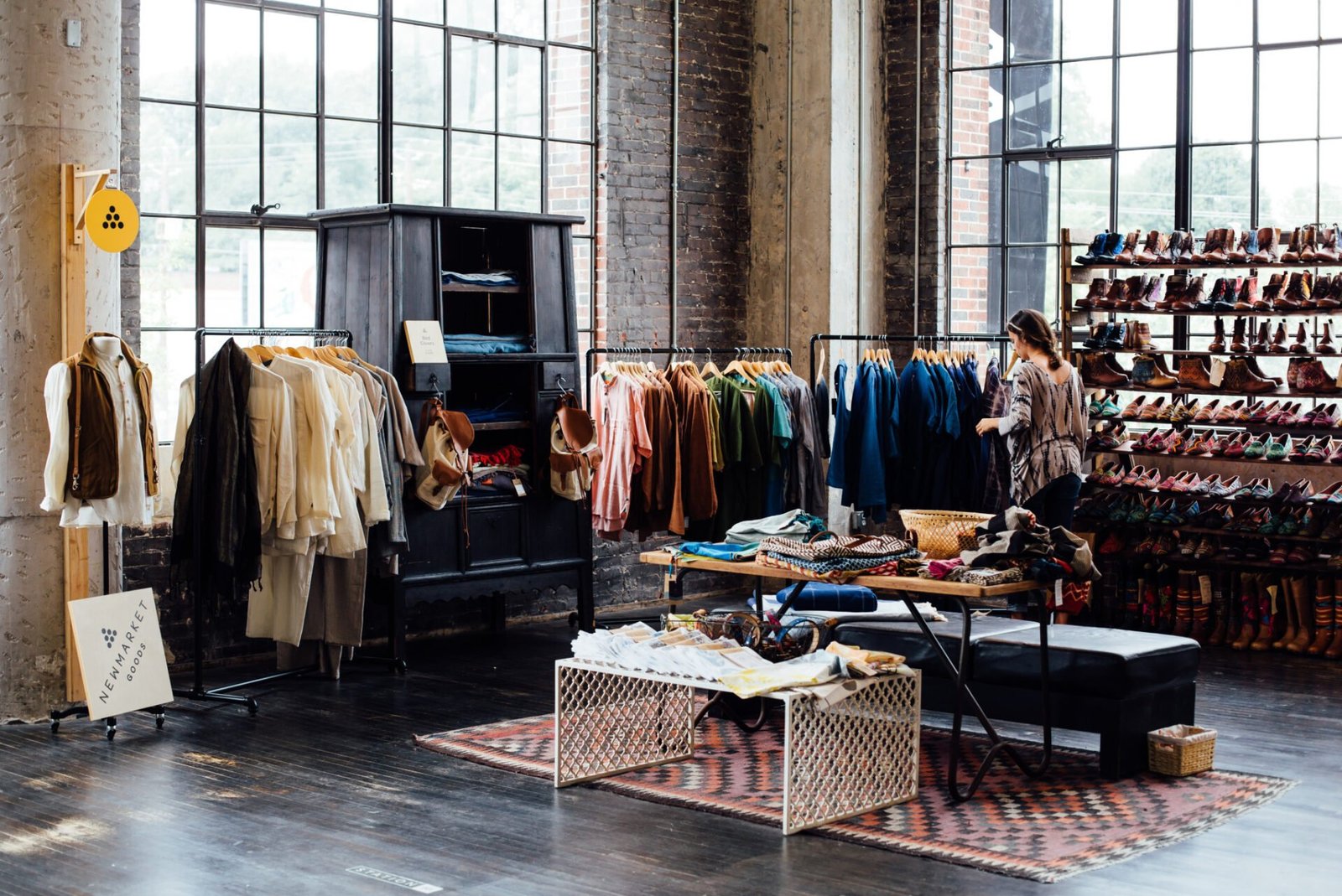 A room full of clothes in a store.