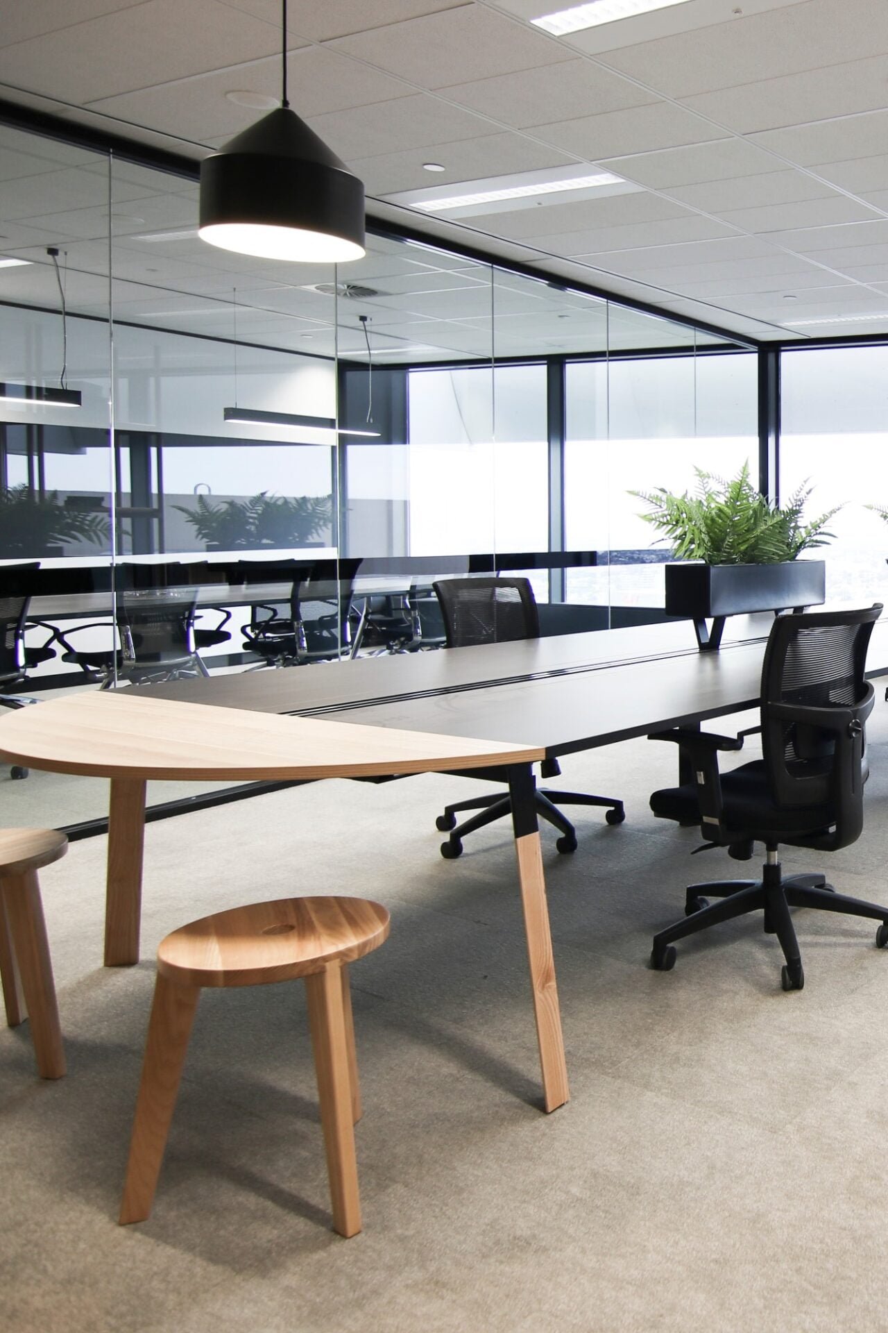 An office with a large table and chairs.